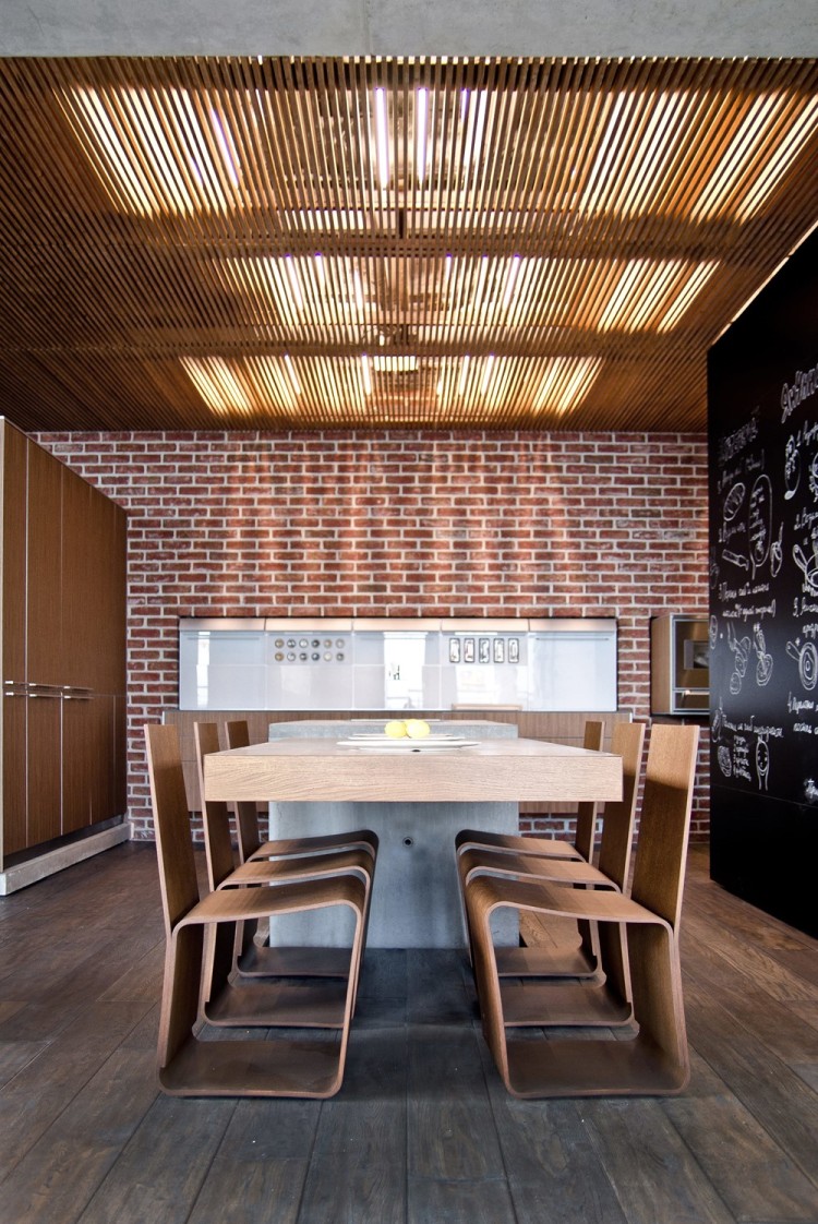 Современный дизайн интерьера кухни-столовой пентхауса в промышленном стиле